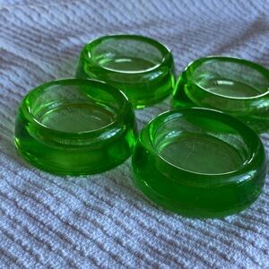Four vintage glass furniture coasters